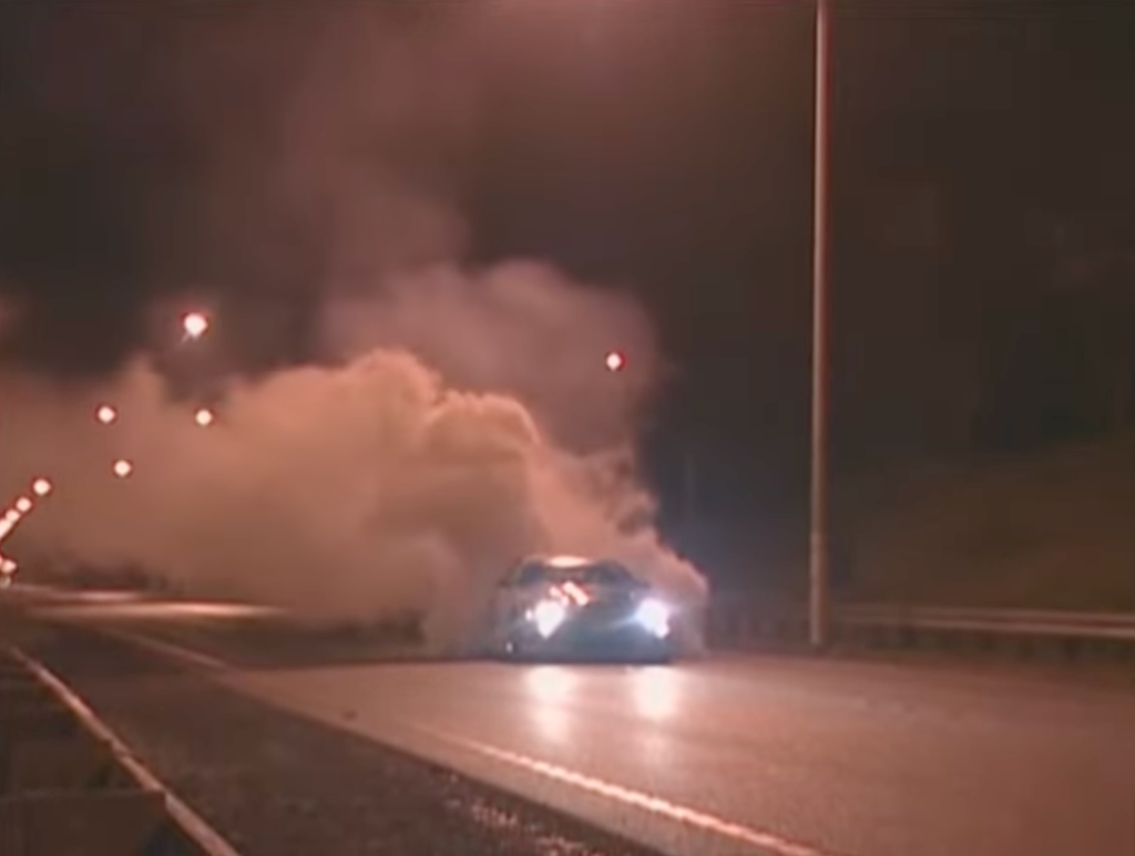 Smoky Nagata performing a high-speed burnout in his Top Secret Supra