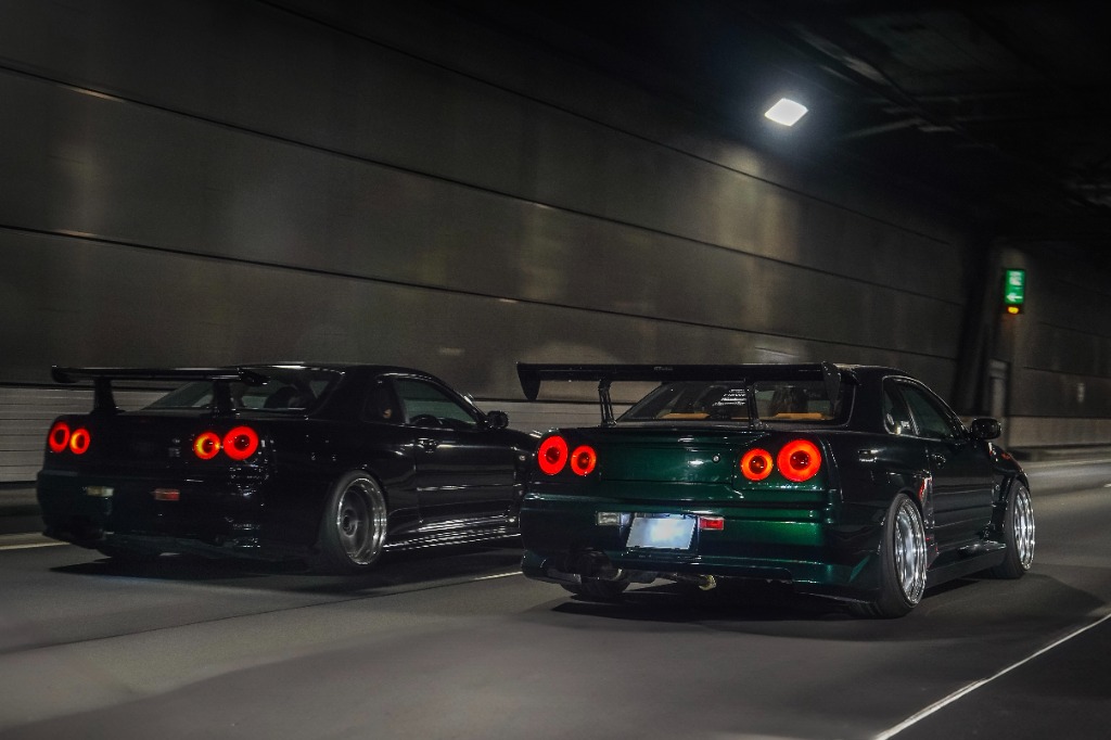 Nissan Skyline R34 GT-R driving through the Aqua-Line tunnel